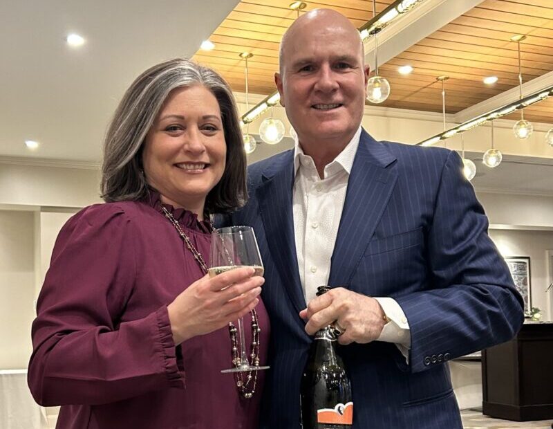 Crisis Services President and CEO Jessica Pirro poses with Kevin LoVullo, host and producer of "Spiel the Wine" on WGRZ-TV, at a previous wine tasting benefit.